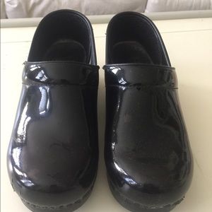 Dansko black patent leather clogs